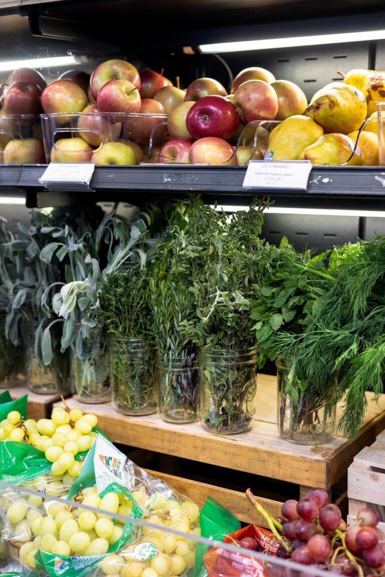 fresh produce and herbs on shelf